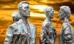 Beautiful sculptures of the four people at colorful sunset background in Nottingham