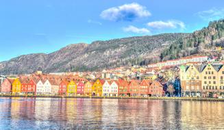 Colorful buildings near the water and mountains in Bergen, Norway