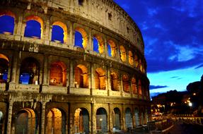 roman colosseum illuminated at sunset