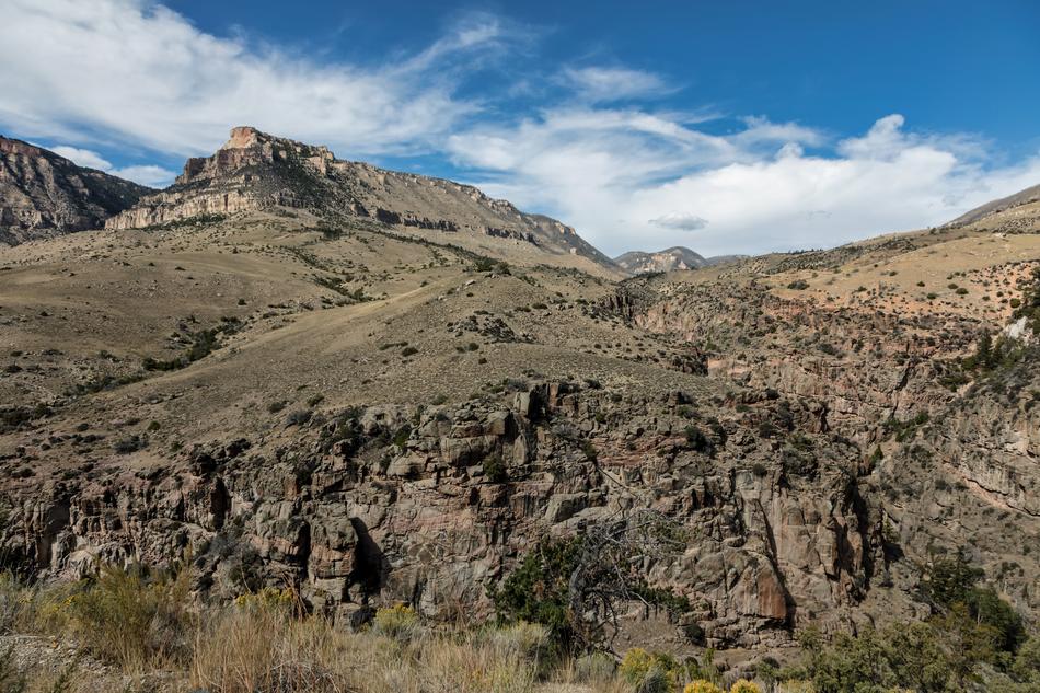 Beautiful Wyoming Mountains at blue sky with white clouds at background in America