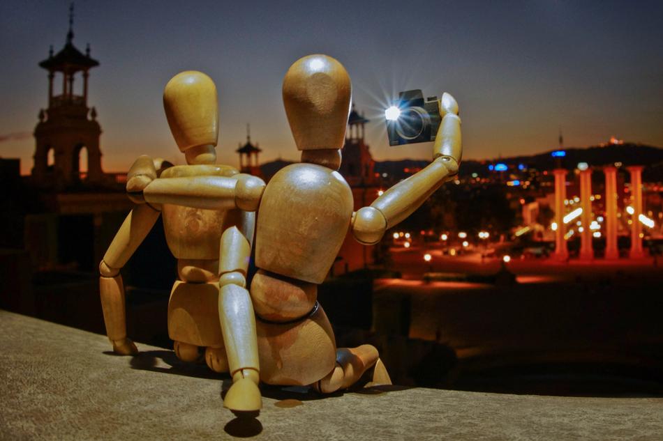 wooden mannequins with a camera in hand