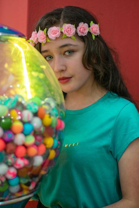 photo of a caucasian girl and a ball with colorful chewing gum