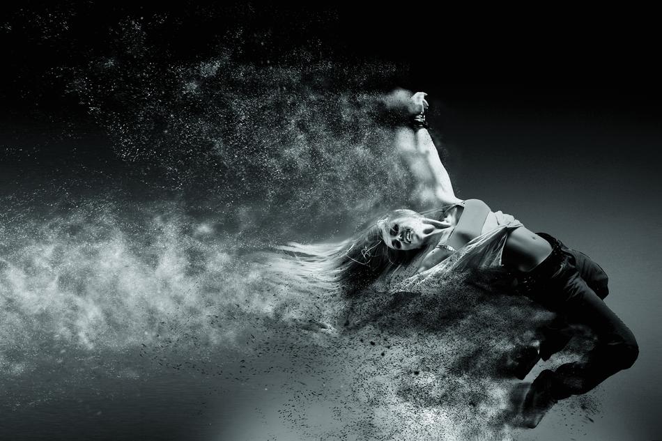 Black and white photo of the person in movement, among the smoke