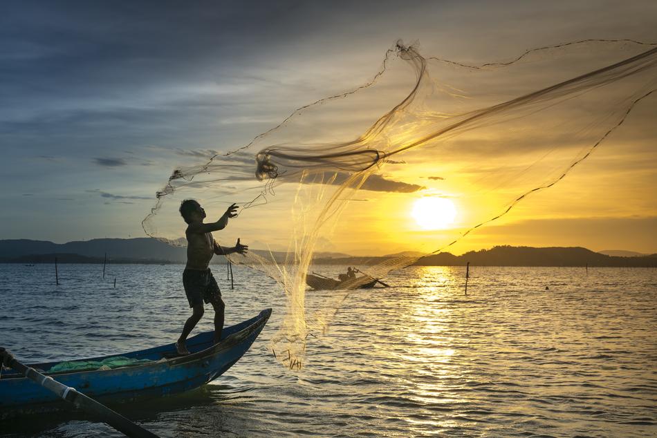 Fishing Net man On the Sunset