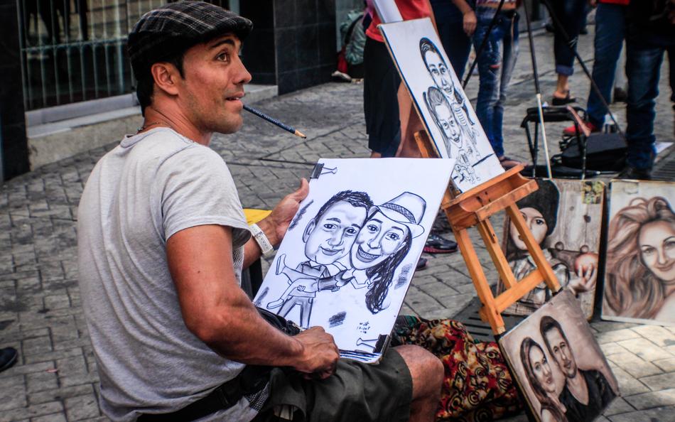 Man drawing art on the street