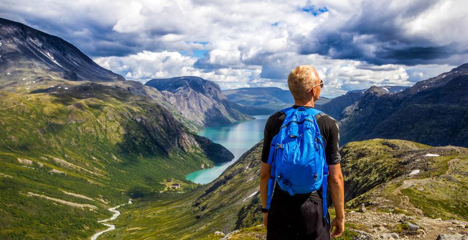 tourist in the mountains of norway on a sunny day