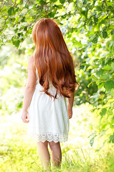 girl red hair in garden