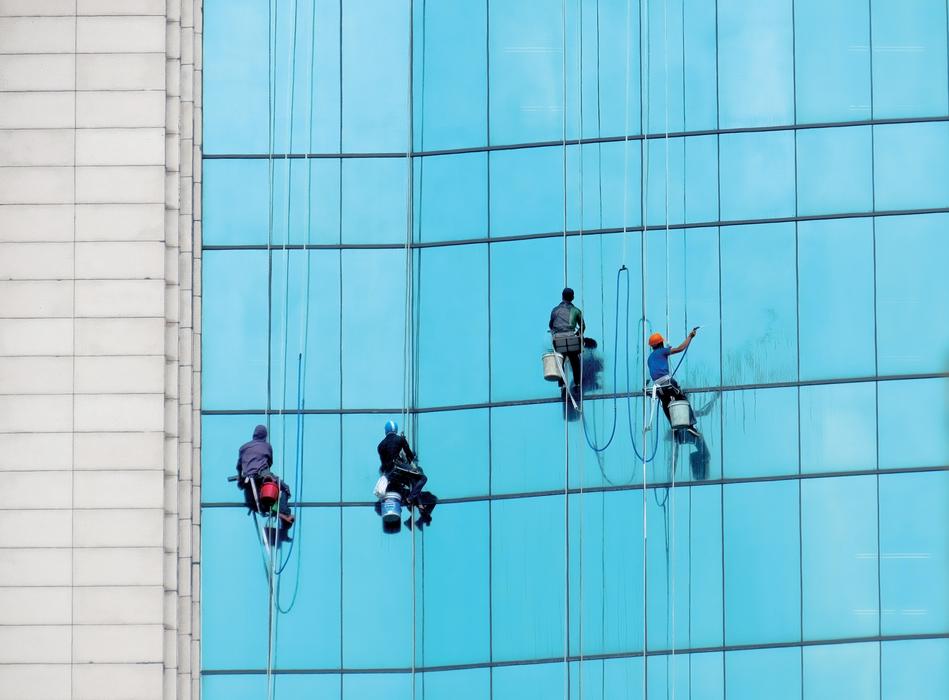 for cleaners at work on glass facade, hanoi, vietnam