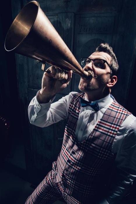 man with mustache and gramophone