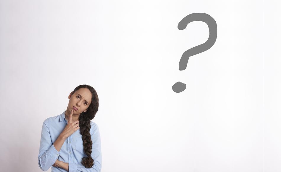 photo of a girl with a thick pigtail and a gray question mark