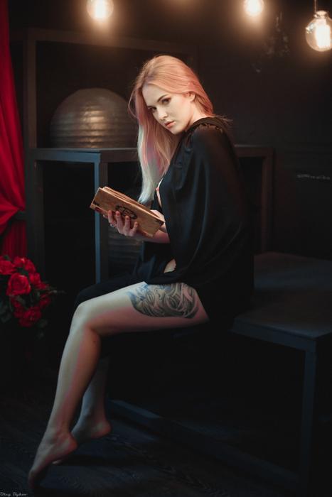 beautiful woman with book as a magic