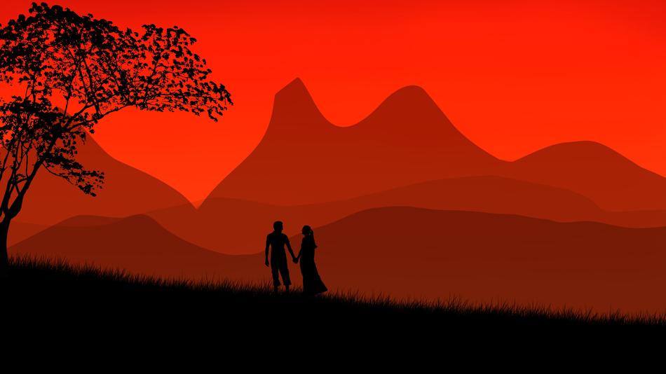 romantic couple on the mountains’ background