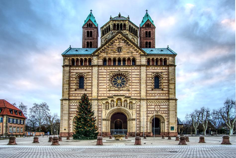 Beautiful and colorful church, near the building and tree, in Germany, at colorful and beautiful sky on background