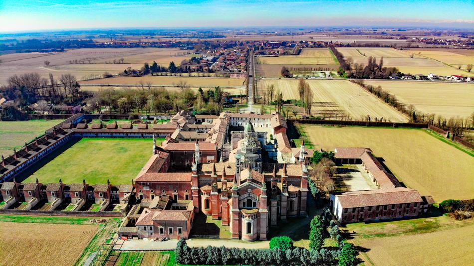 aerial view of Monastery of Santa Maria delle Grazie in countryside, italy, pavia