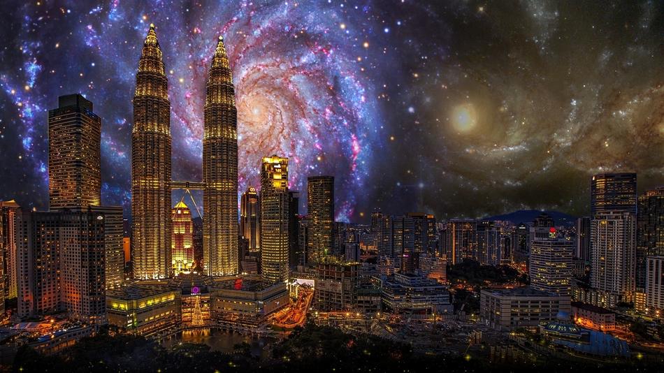 Petronas Towers against the backdrop of the mysterious starry sky in Kuala Lumpau, Malaysia