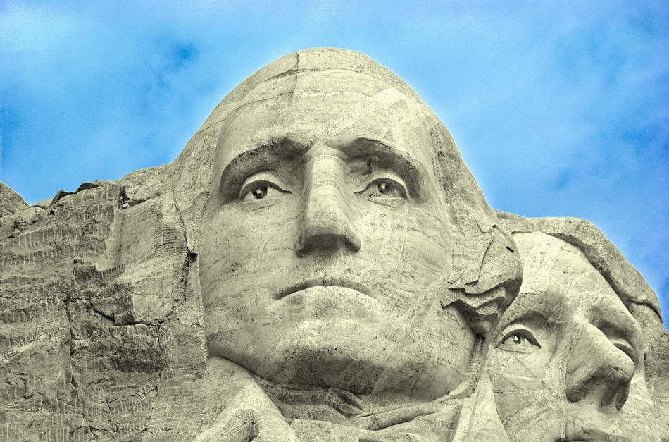 Beautiful portrait of Washington on the Rushmore mount, under the blue sky with white clouds
