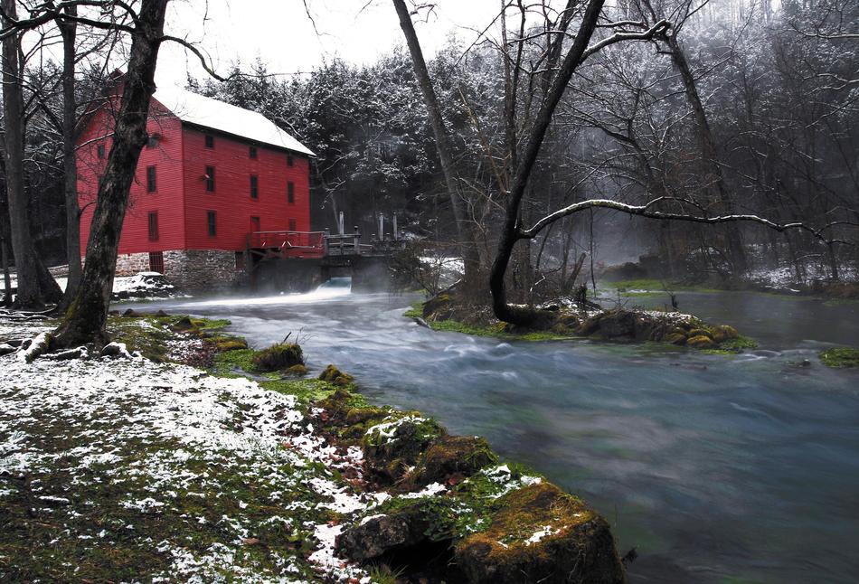 Gristmill Building among the plants near the water