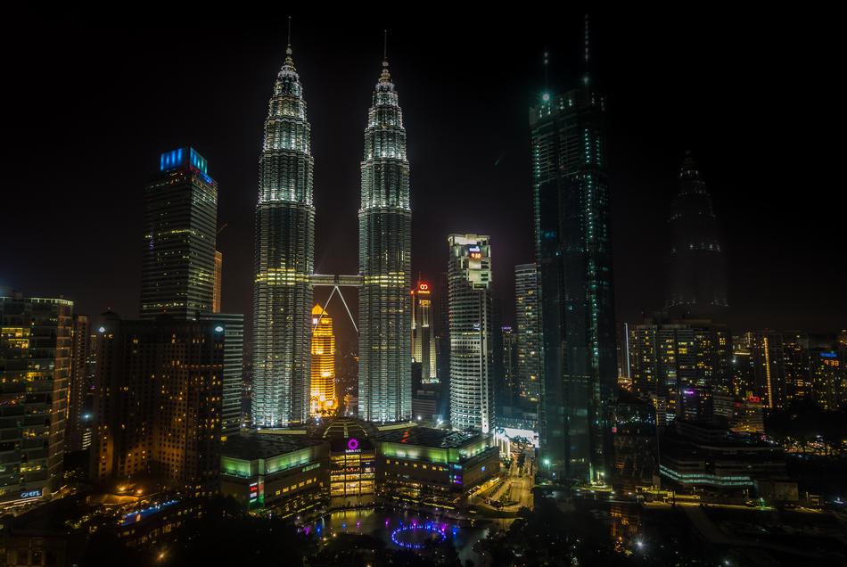 Beautiful cityscape of Kuala Lumpur, with colorful lights at night, in Malasia