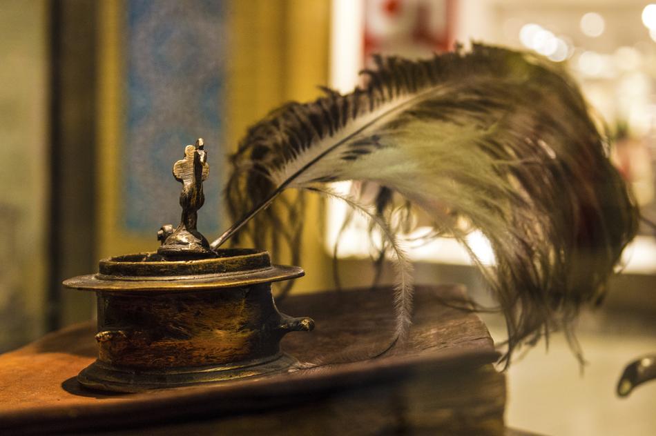 quill in antique metal ink