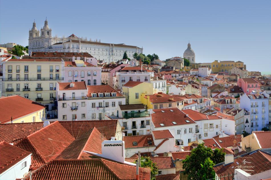 Beautiful cityscape of Alfama, Lisbon, Portugal, with the colorful houses, at blue sky on background