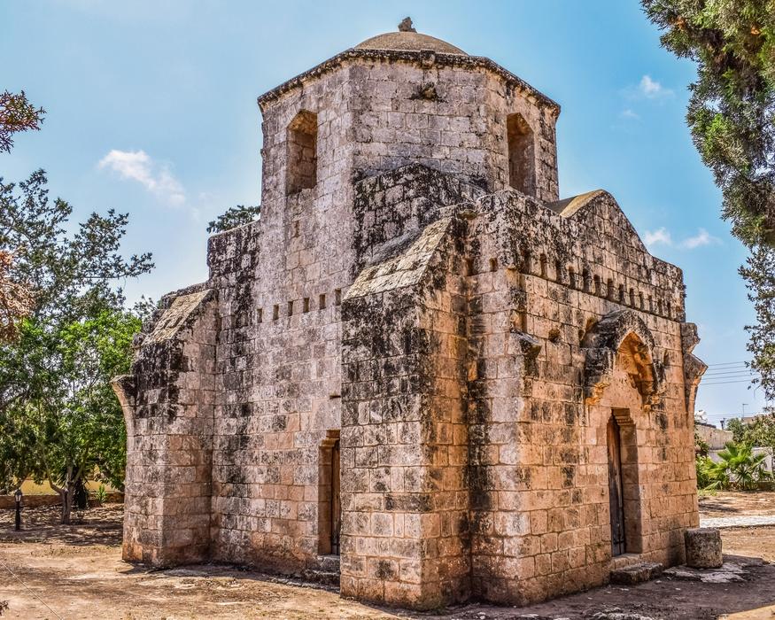 Beautiful landscape with the church, among the green trees in Ayios Mamas, Cyprus, Greece
