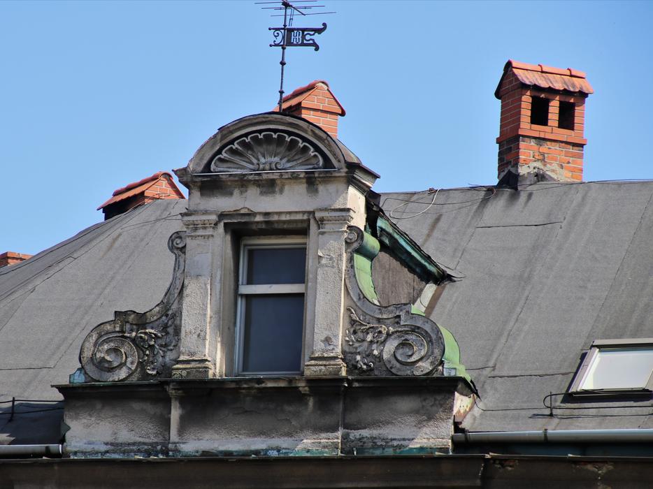 Attic Window with plaster ornament and wind vane