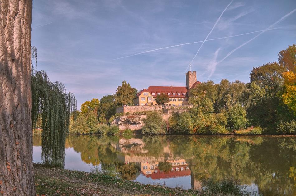 romantic photo of the castle on the shore of the reservoir