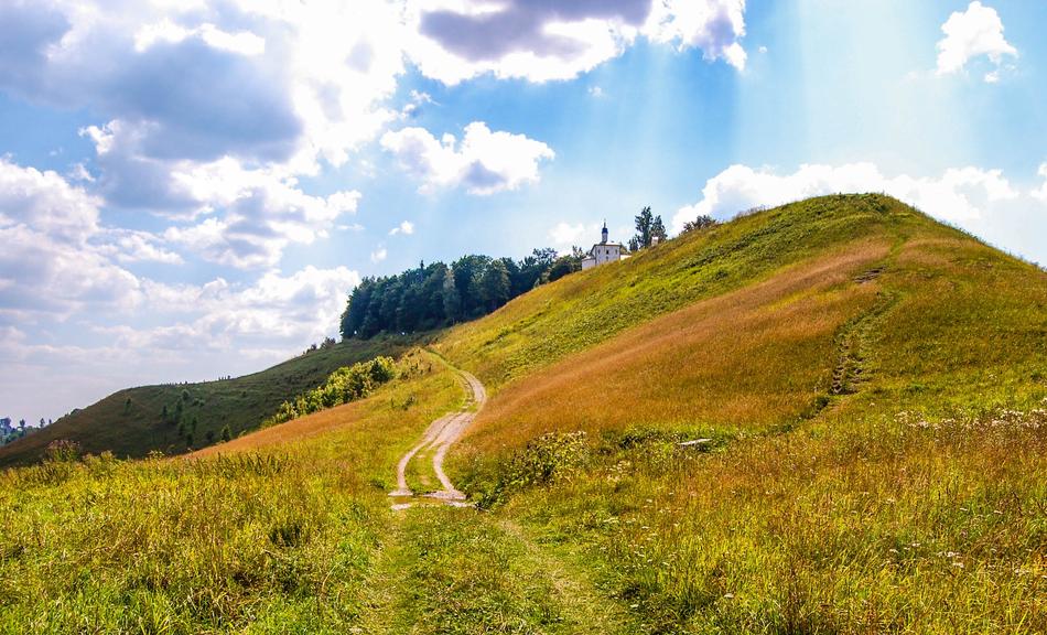 Beautiful summer landscape, Clouds in blue sky above green hill