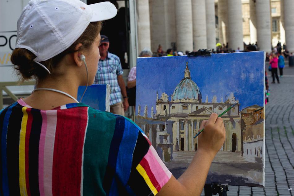 street artist painting the vatican