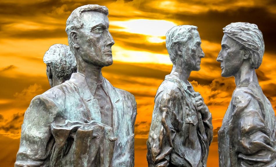 Beautiful sculptures of the four people at colorful sunset background in Nottingham