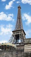 sky with white clouds over the eiffel tower