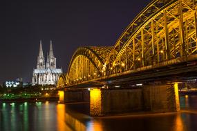 landscape of illuminated bridge and river in Cologne