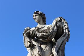 Angel Roma statue and blu sky