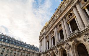 Beautiful and decorated Palais Garnier opera house with columns in Paris, France