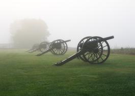 Maryland Cannon on green grass in dense fog
