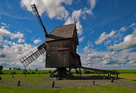 wooden old mill on the field