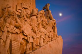 landscape of Lisbon Discoveries Museum and white moon