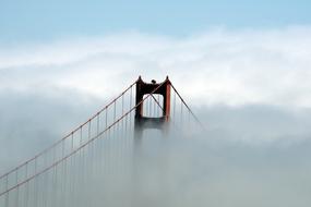 Beautiful Golden Gate Bridge in fog in San Francisco, California, USA