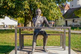 Sculpture man sitting