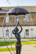 statue of a girl under an umbrella in russia