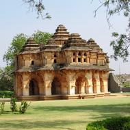 Beautiful landscape with the Lotus Mahal, among the green plants in Hampi, Hospet, India