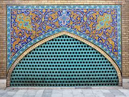 colorful wall with mosaics in iran