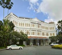 white car near the famous hotel in singapore