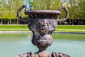 sculpture in the form of a vase in a fountain in the park