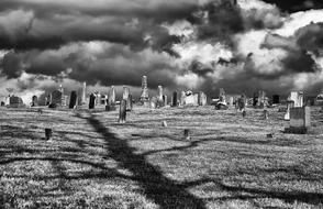 dramatic sky over the old cemetery in black and white background