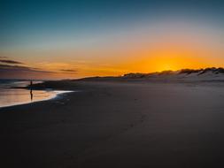 lonely man on evening beach in Africa