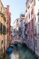 canal with gondolas near the bridge in venice