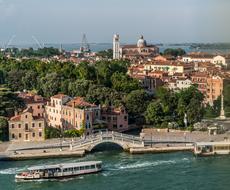 Beautiful Venice, with the colorful buildings and green trees, in Italy