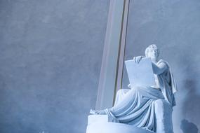 Roman sculpture with the board, in light