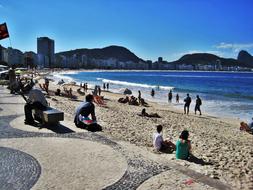 people on copacabana beach on a sunny day